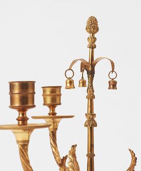 A pair of  Louis XVI-style late 19th century three-light candelabra.