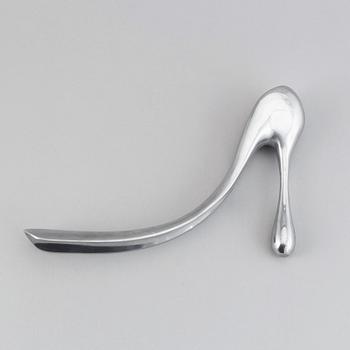 A metal shoe horn by Manolo Blahnik, 2000s.