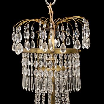 An early 20th century late gustavian style chandelier.