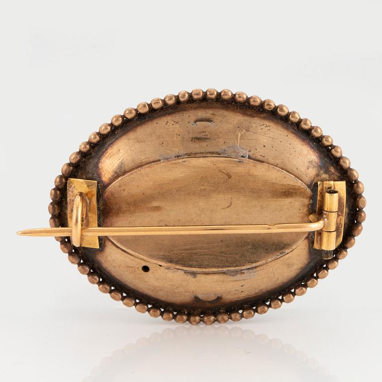 A 19th century 18K gold and paste brooch.