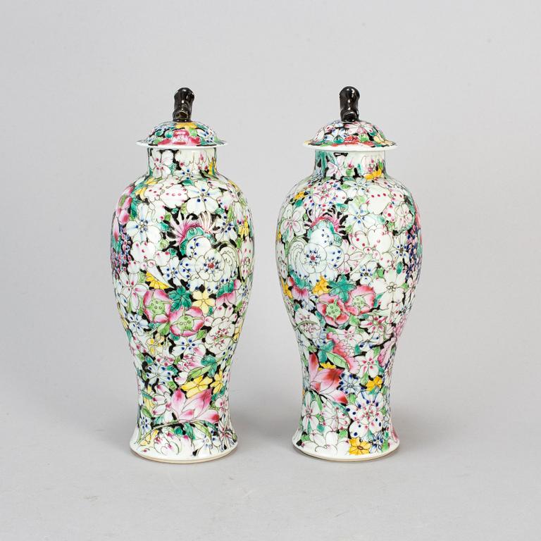 A pair of Chinese 'Mille fleur' porcelain vases with covers, 20th century.