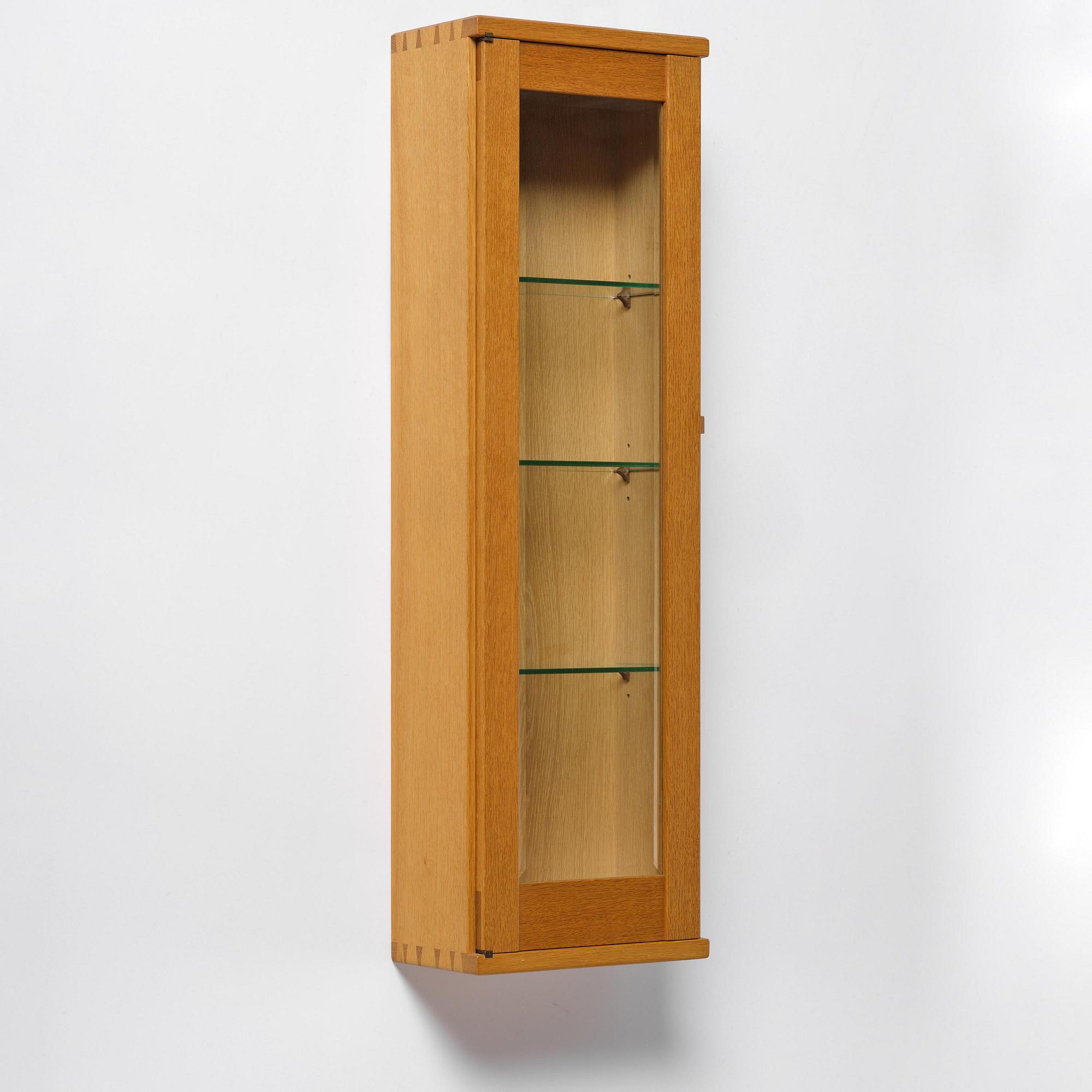 James Krenov, an oak or doussie showcase wall cabinet, executed in his own workshop, Bromma, Sweden.