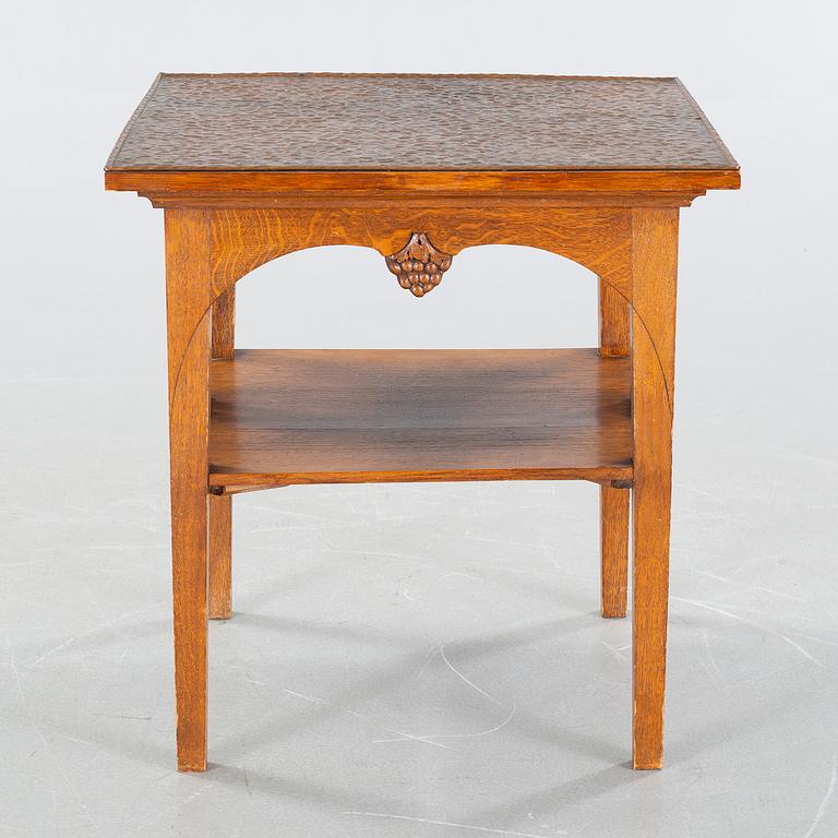 CARL CHRISTIAN CHRISTENSEN, a jugend smoking table, signed and dated 1910.