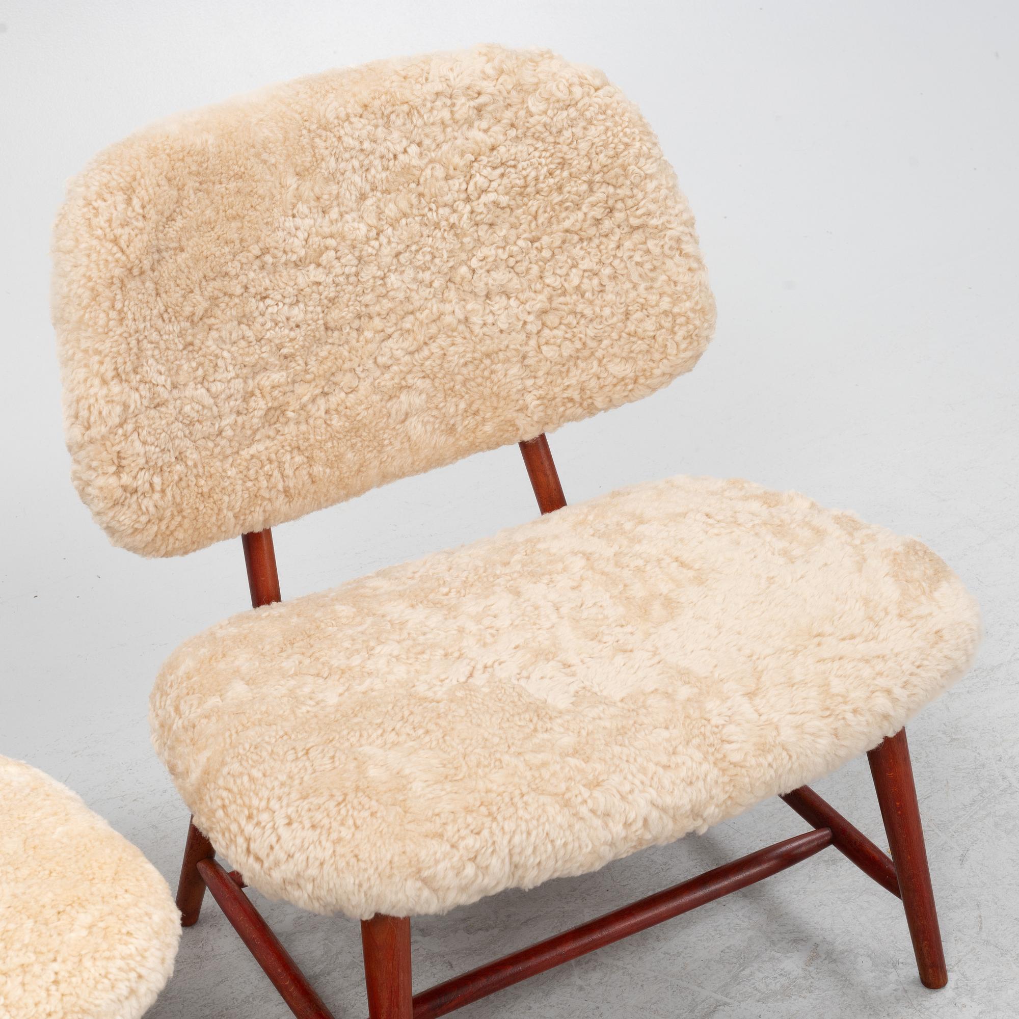 Alf Svensson, a pair of 'TeVe' easy chairs with new sheepskin upholstery, 1950s.
