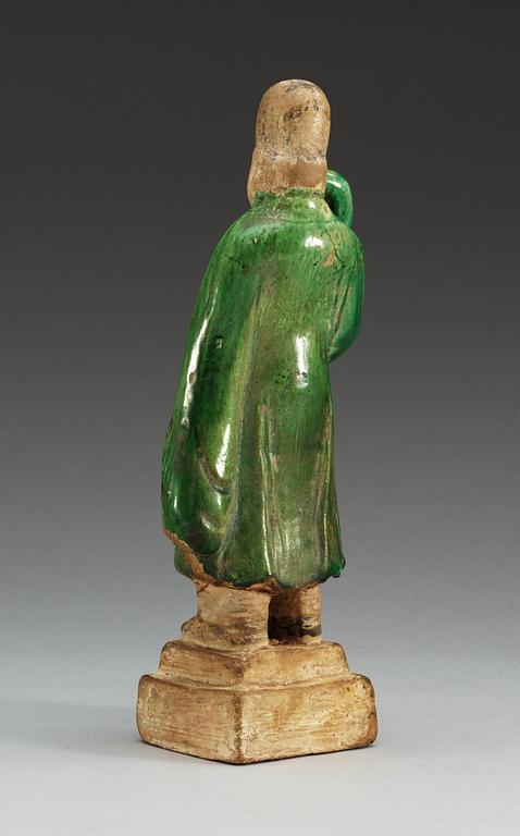 A green glazed figure of a man, Ming dynasty.