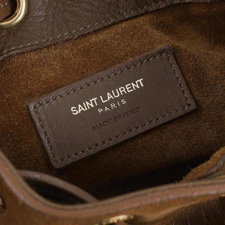 Yves Saint Laurent, a suede fringe handbag.