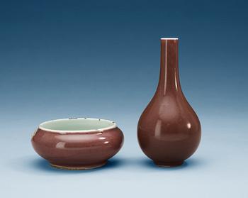 1419. A sang de boef glazed brush water-pot and vase, Qing dynasty, with Qianlong four character mark and Yongzheng six character mark.