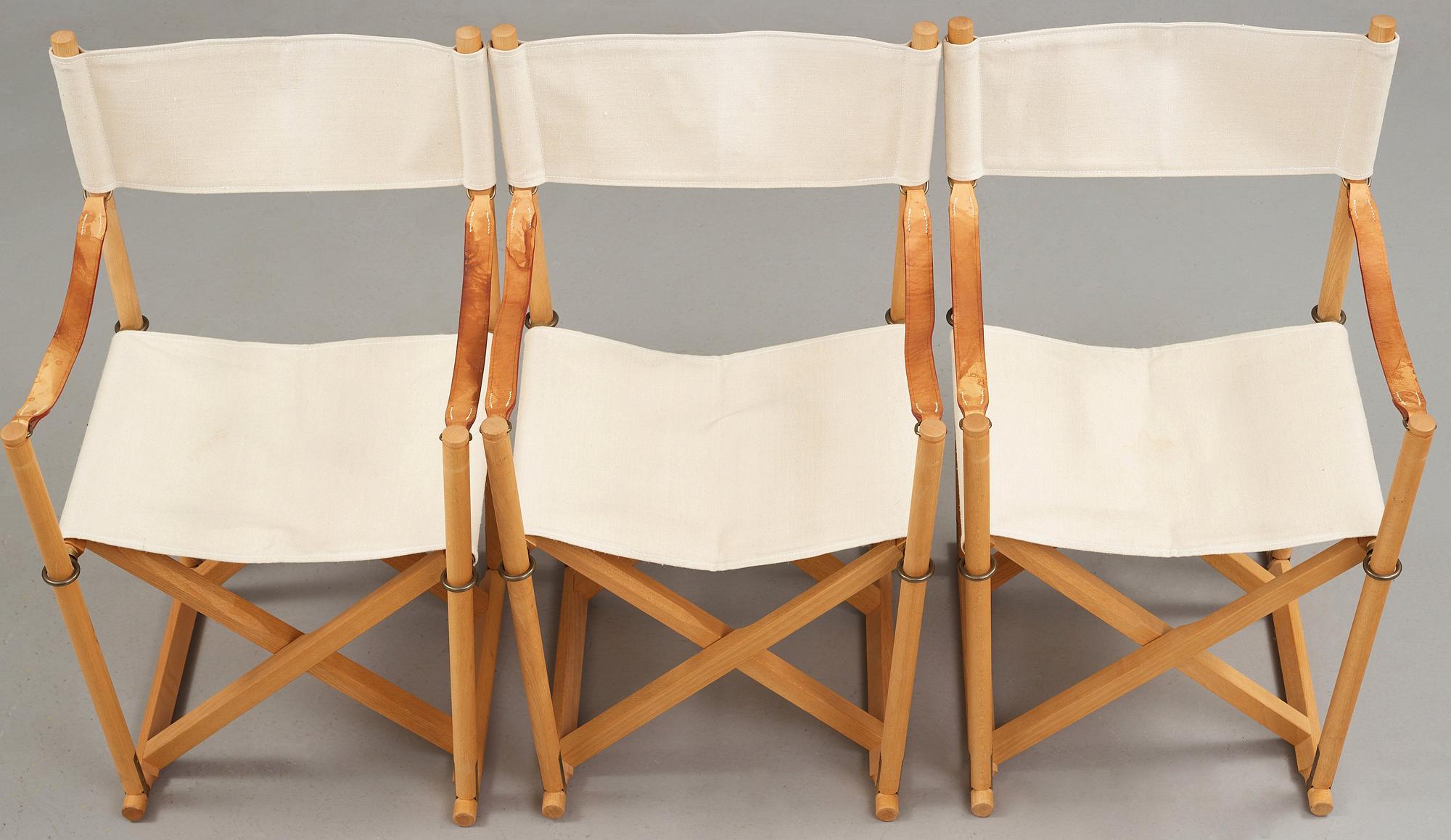 Mogens Koch, a set of six beech and canvas 'MK16' folding chairs, comes with a stand for storage, Rud Rasmussen, Denmark.