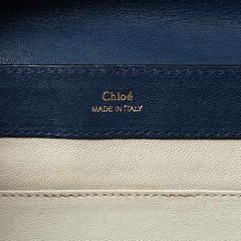 Chloé, a blue leather bag.