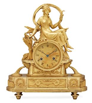 667. A French Empire early 19th Century mantel clock.