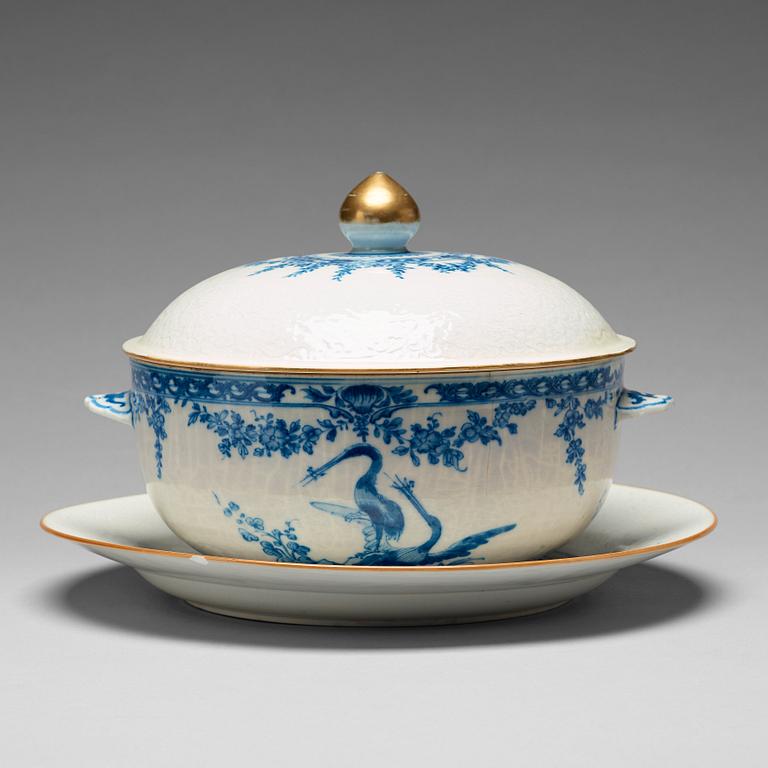 A blue and white armorial tureen with cover, and stand, Qing dynasty, 18th Century.