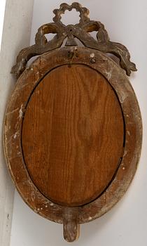 A pair of late Gustavian one-branch giltwood girandole mirrors, Stockholm, circa 1800.