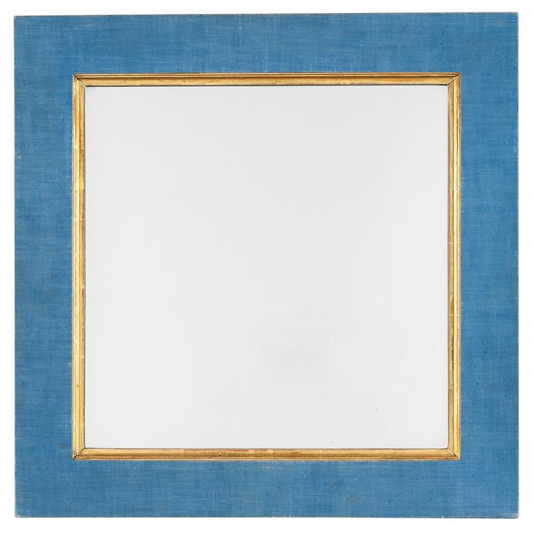 A mirror attributed to Estrid Ericson, Svenskt Tenn. The frame with blue fabric.