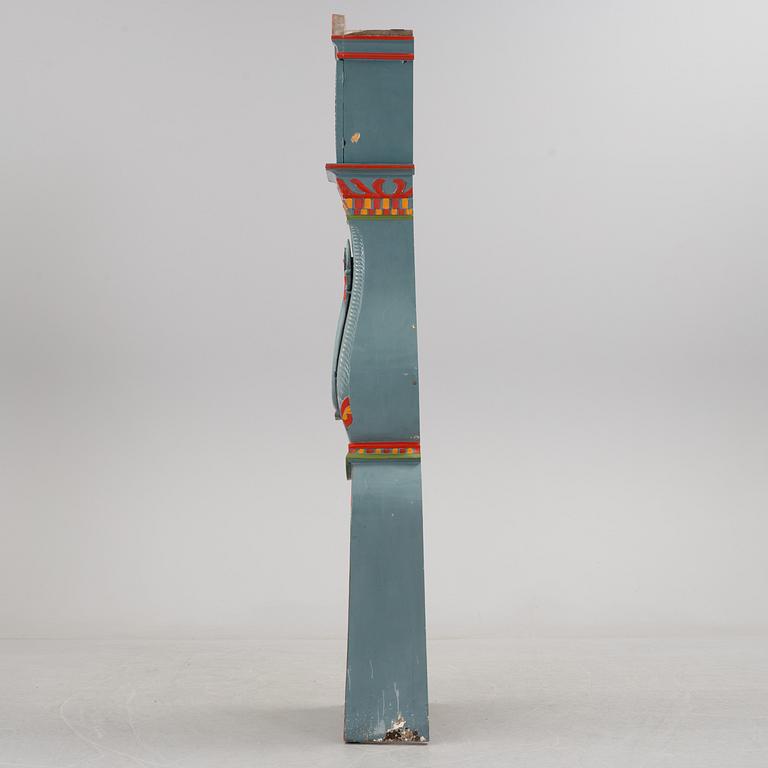 a painted grandfather-clock from the first half of the 19th century.