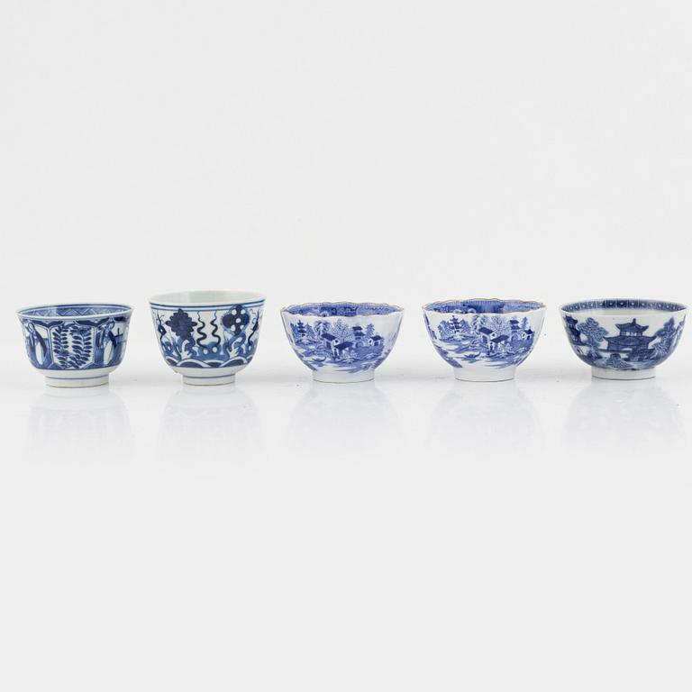 A group of thirteen cups, a bowl and a cup holder, four saucers, partly China and 18th century,