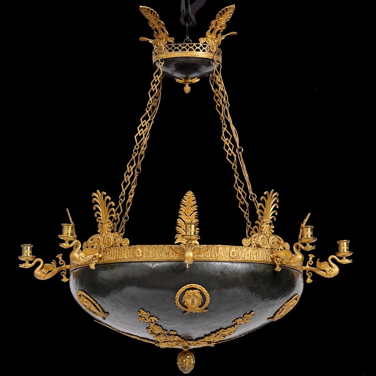 A presumably Russian Empire gilt and patinated bronze nine-branch chandelier, 19th century.
