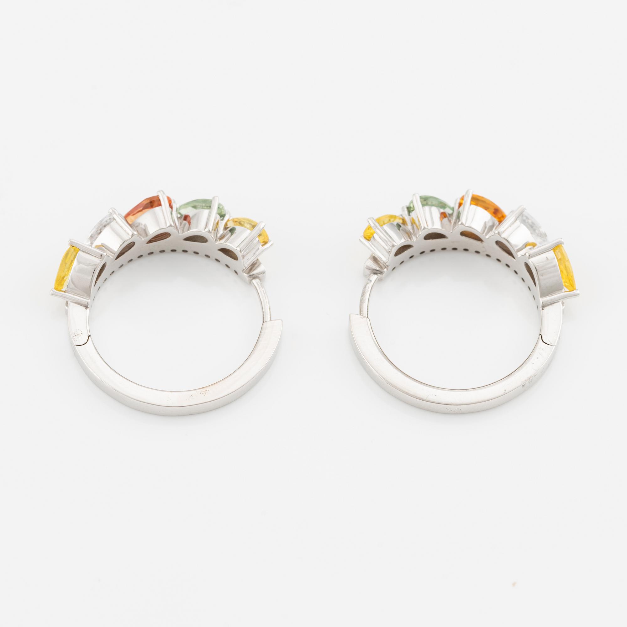 A pair of 14K gold earrings with multicoloured sapphires and diamonds.