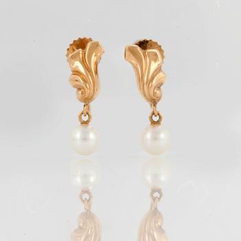 A pair of earrings set with cultured pearls.