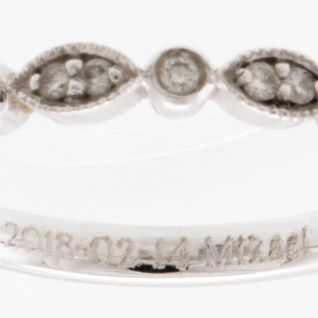 Ring in 18K white gold set with a pear-shaped diamond and round brilliant-cut diamonds, Van Bruun.