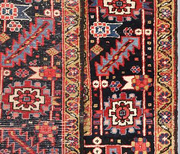 A semi-antique Heris carpet, approx. 343 x 260 cm.