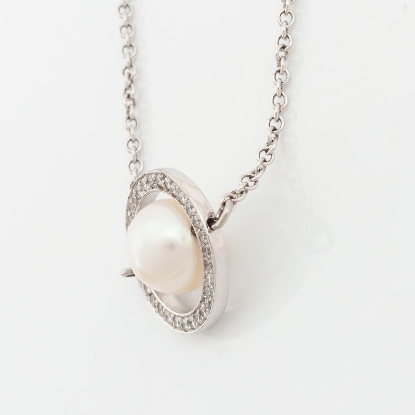 18K white gold, cultured pearl and brilliant cut diamond necklace.