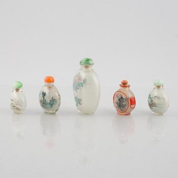 A group of nine Chinese glass and porcelain snuffbottles, 20th century.