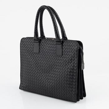 Bottega Veneta, a black leather briefcase.