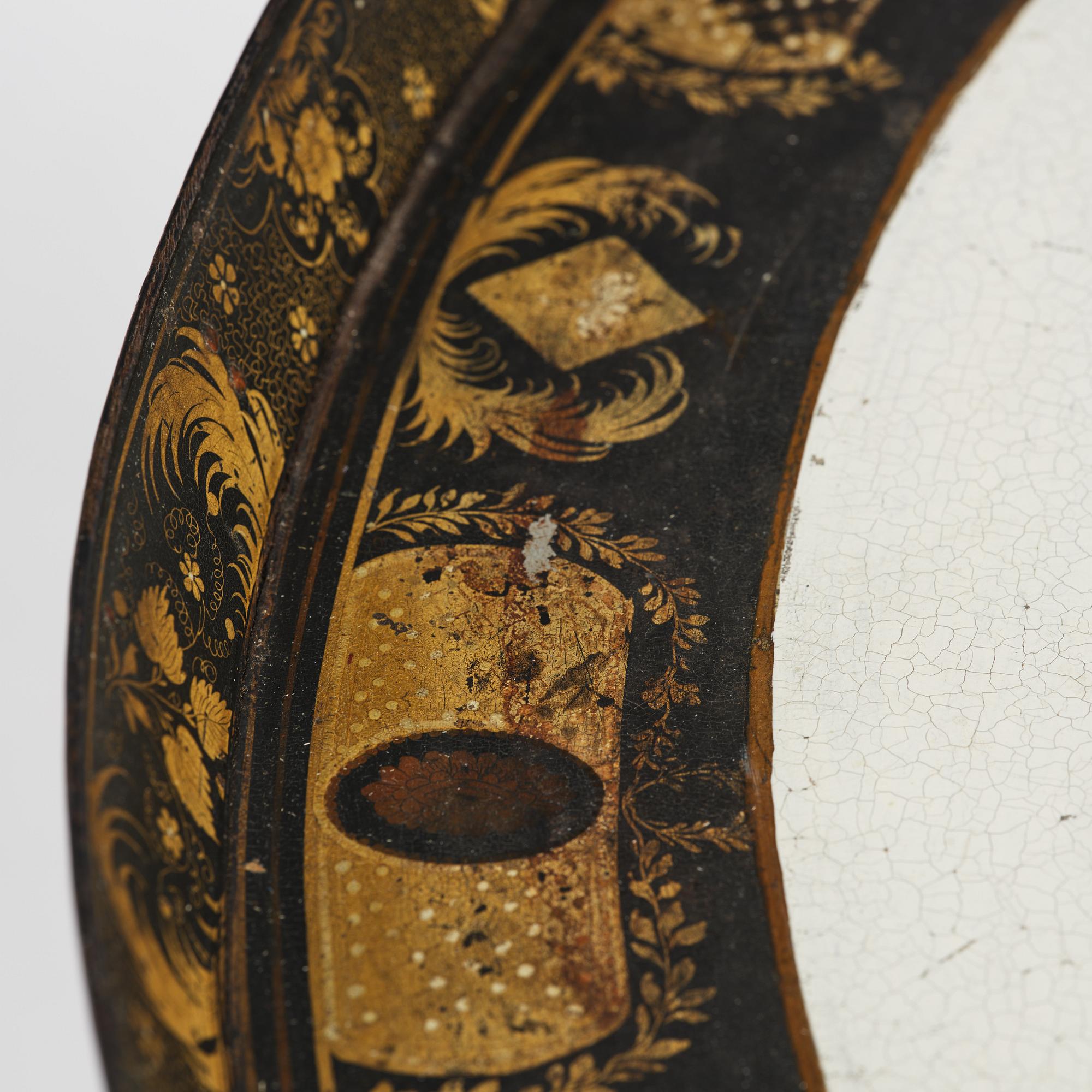 A tole-peinte Empire tray, first part 19th century on a later stand.