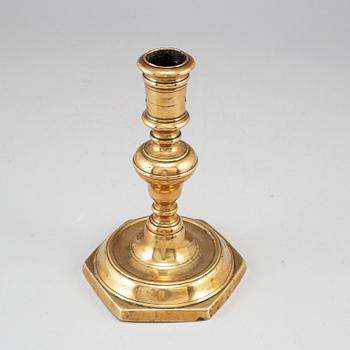 A 17th century bronze candlestick.