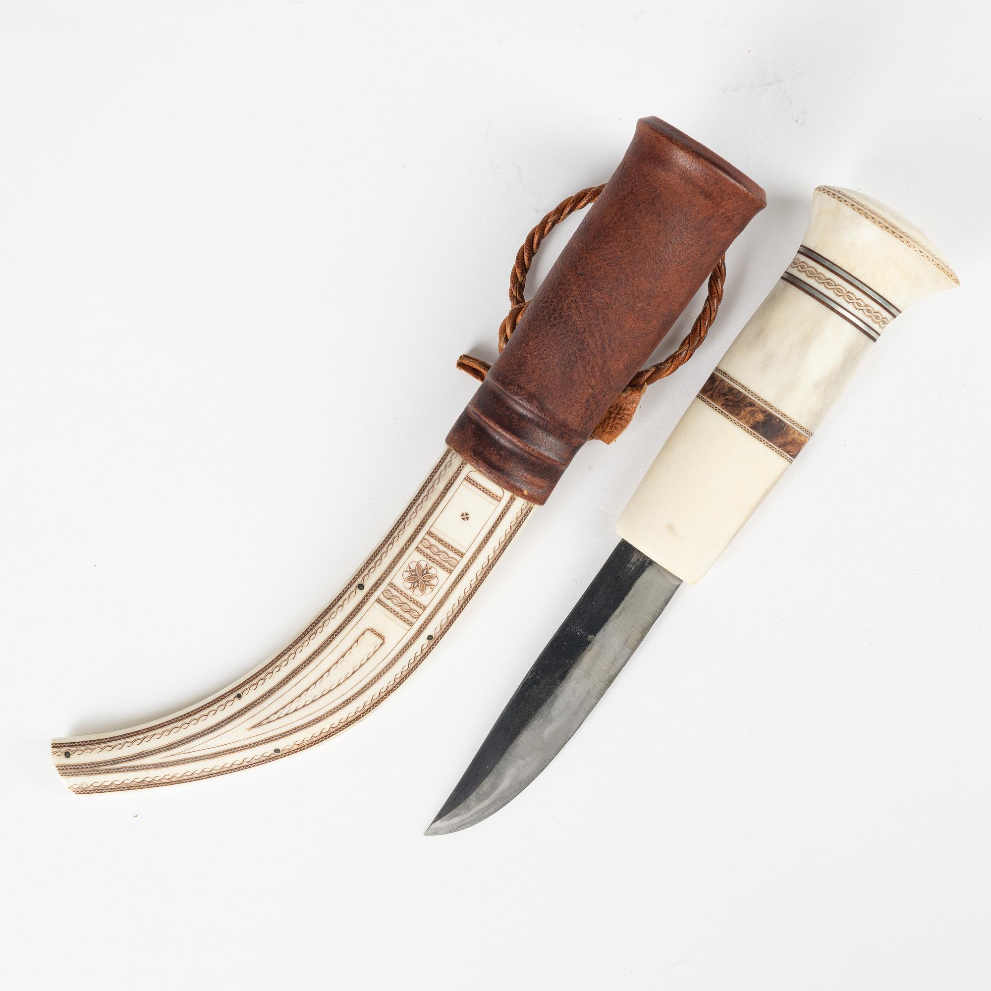 A reindeer horn knife by Olav Svonni, signed and dated 1989.