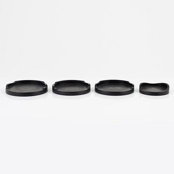 Magnus Ek, a set of four ebony coasters for Oaxen Krog.