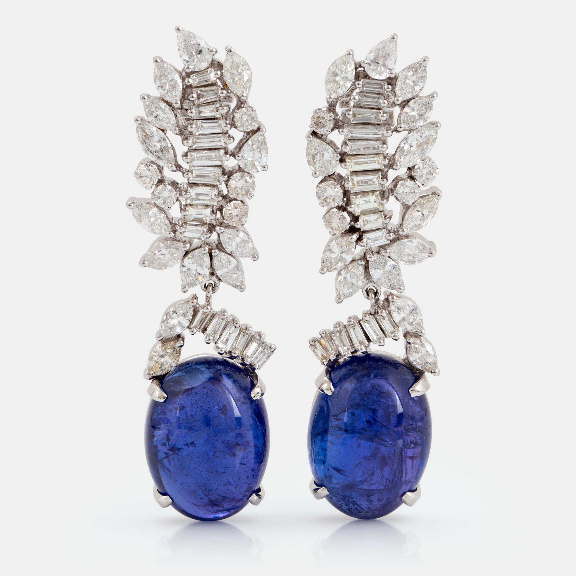 A pair of 18K gold tanzanite earings set with diamonds of various shapes.