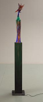 A unique Kjell Engman sand cast glass sculpture of a bird, iron base, on wooden electrified stand, Kosta Boda, Sweden 2002.