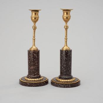 A pair of late Gustavian circa 1800 porphyry and gilt bronze candlesticks.