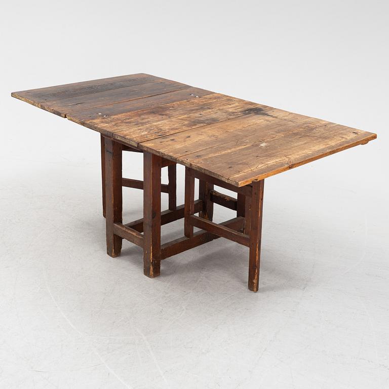 A pine gate-leg table, 19th Century.