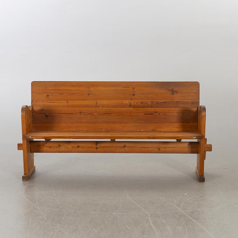 A 20th century Swedish stained pine sofa.