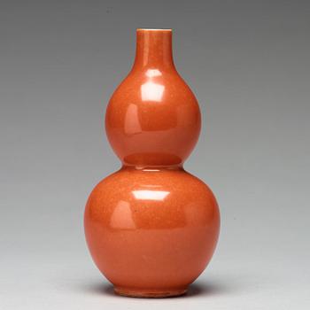 A coral red calebass shaped vase, Qing dynasty with Jiaqing mark (1796-1820).