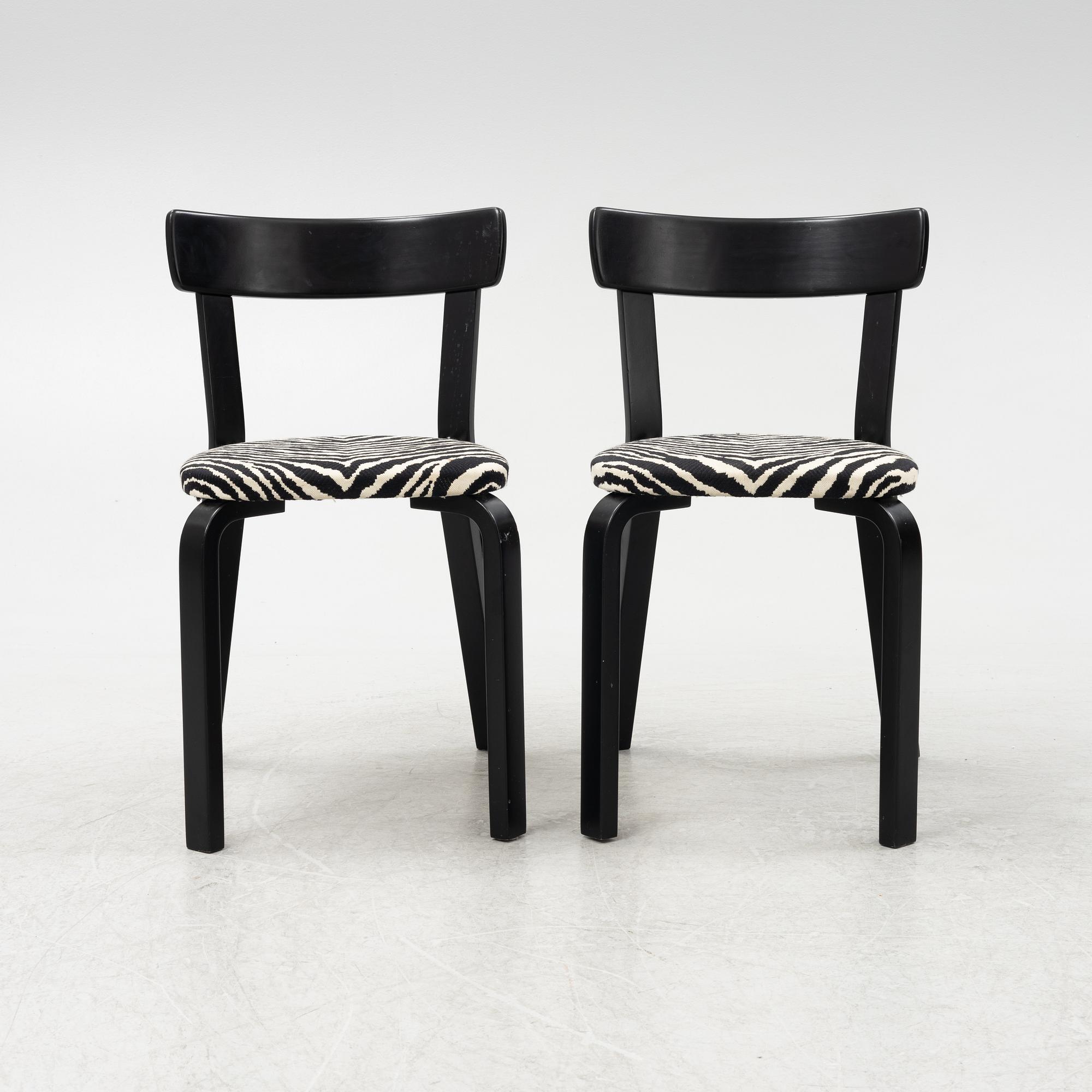 Alvar Aalto, a dining table and eight chairs, model 69, Artek, Finland, end of the 20th century.