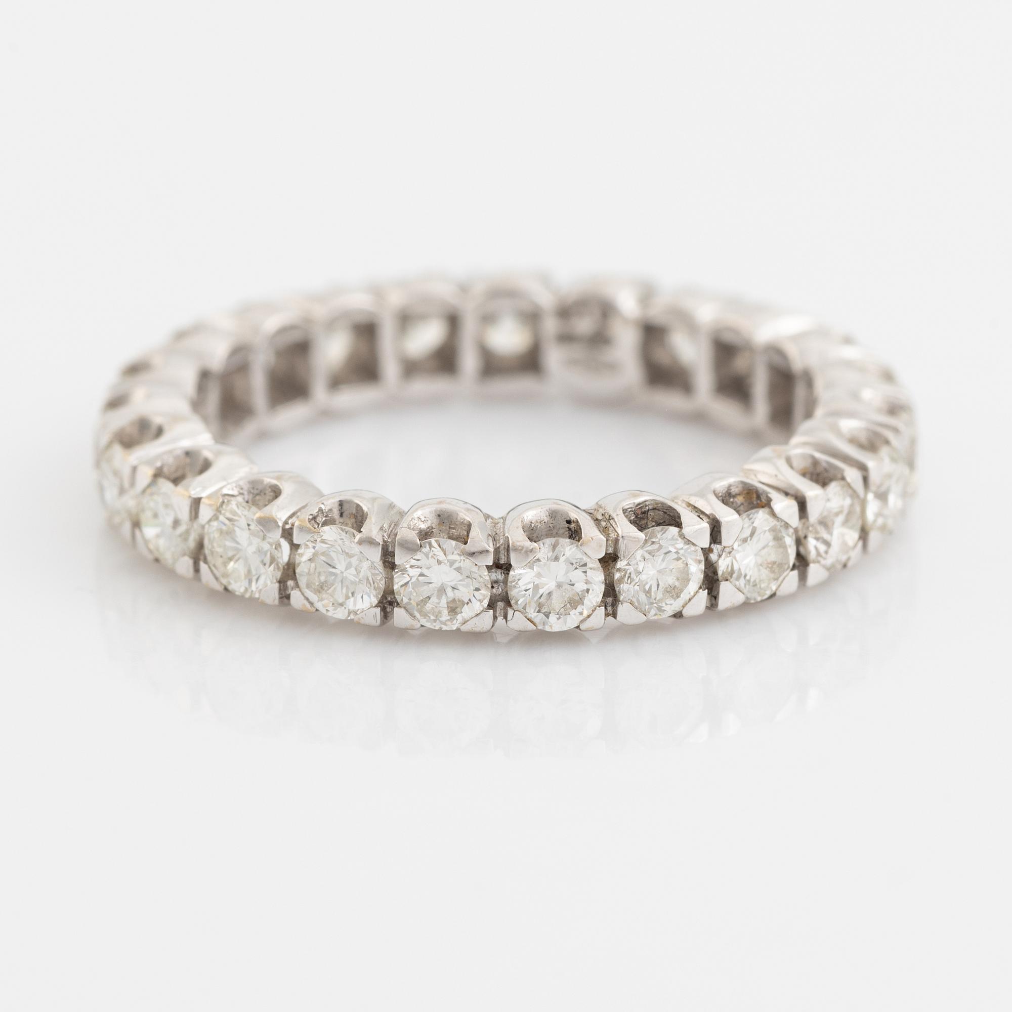 Brilliant cut diamond eternity ring.