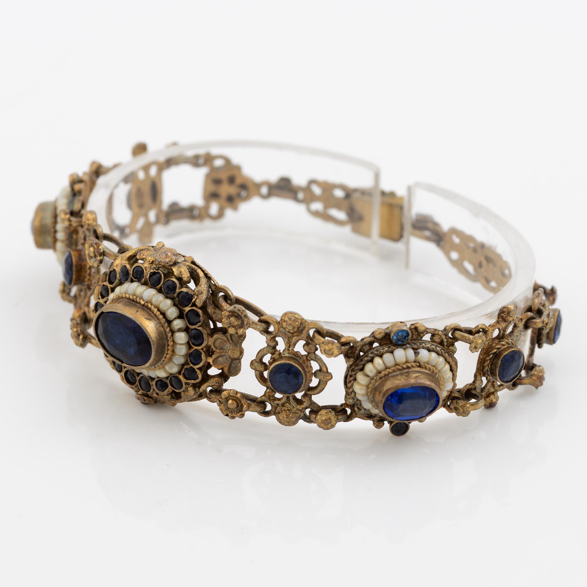 Bracelet, gilded silver with synthetic blue stones.