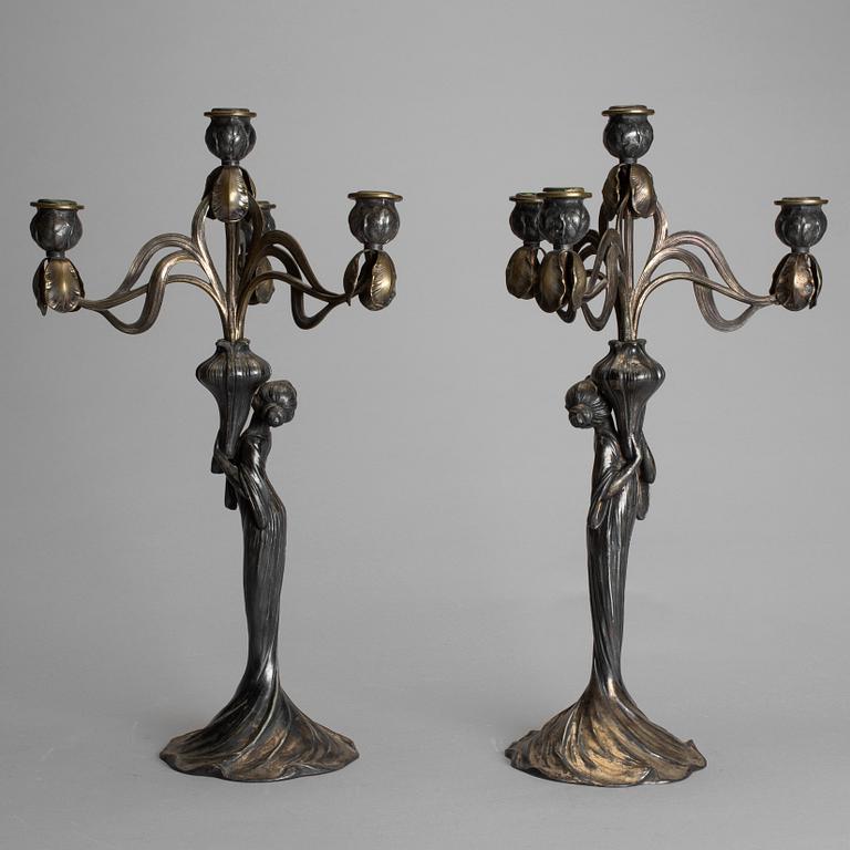 A pair of art noveau chandeliers by WÜRTEMBERGISCHE METALLWAREN FABRIK (WMF), Germany.