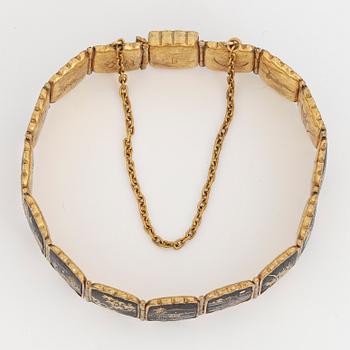 ARMBAND, gul metall med japanskt motiv.