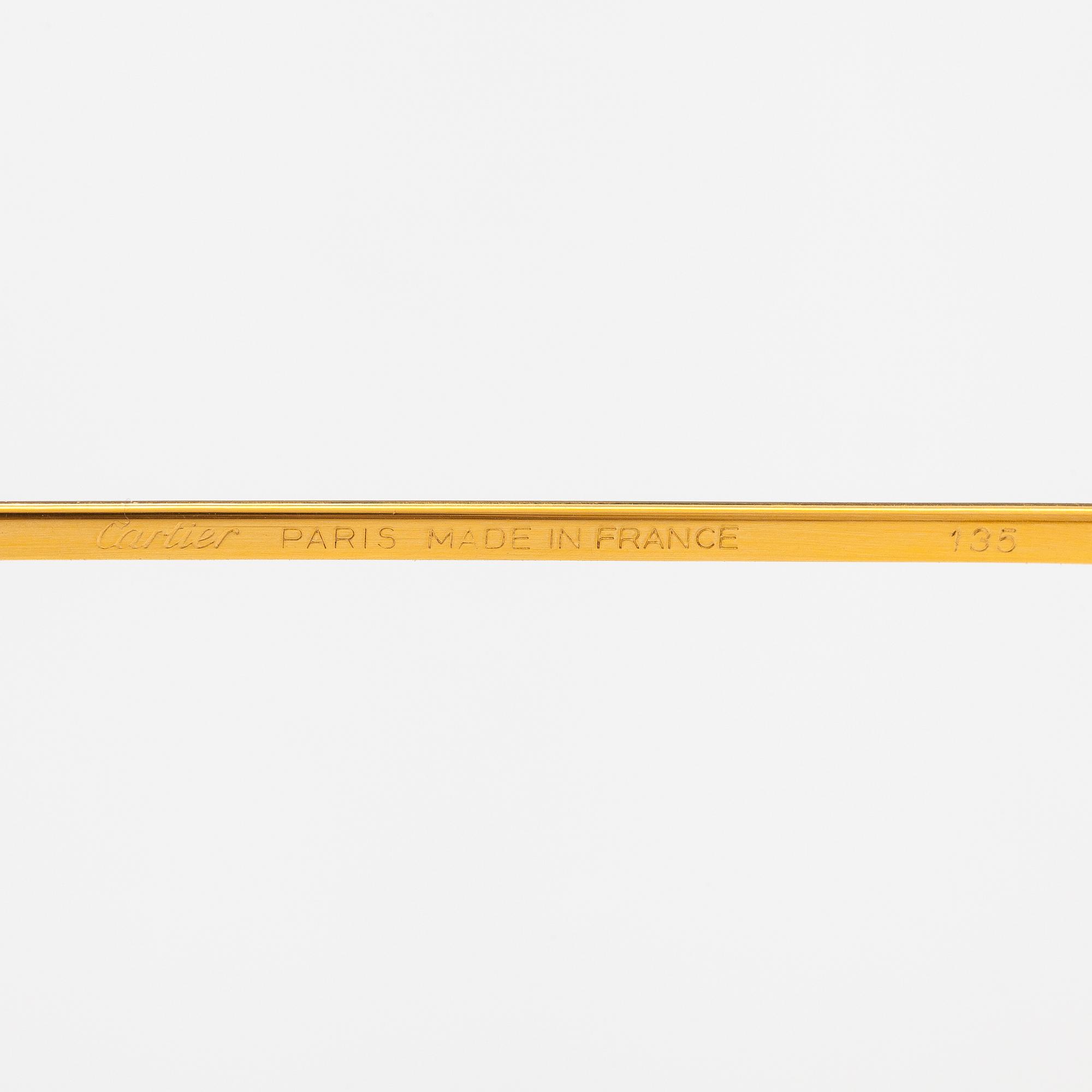 must de Cartier, Santos, a pair of eyeglass frames. Marked Cartier, Paris, Made in France 135, 56, 16.