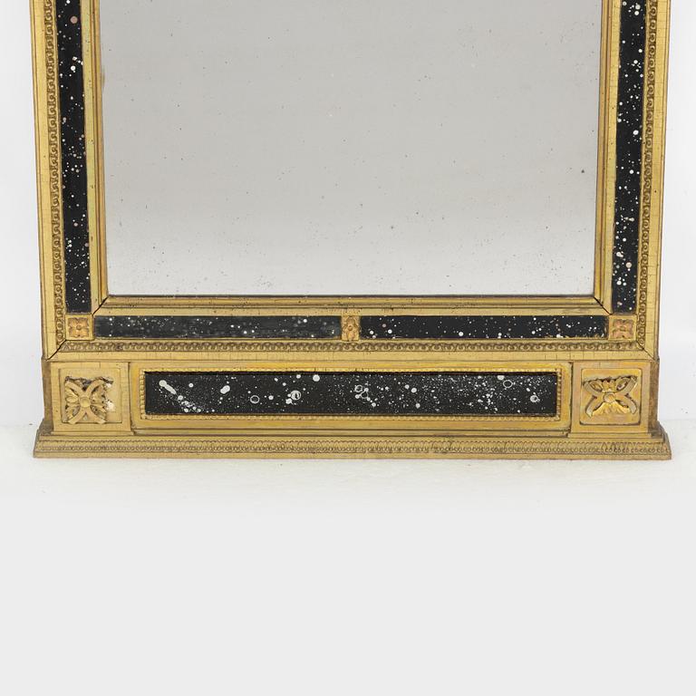 A late Gustavian giltwood and faux-porphyry mirror, late 18th century.