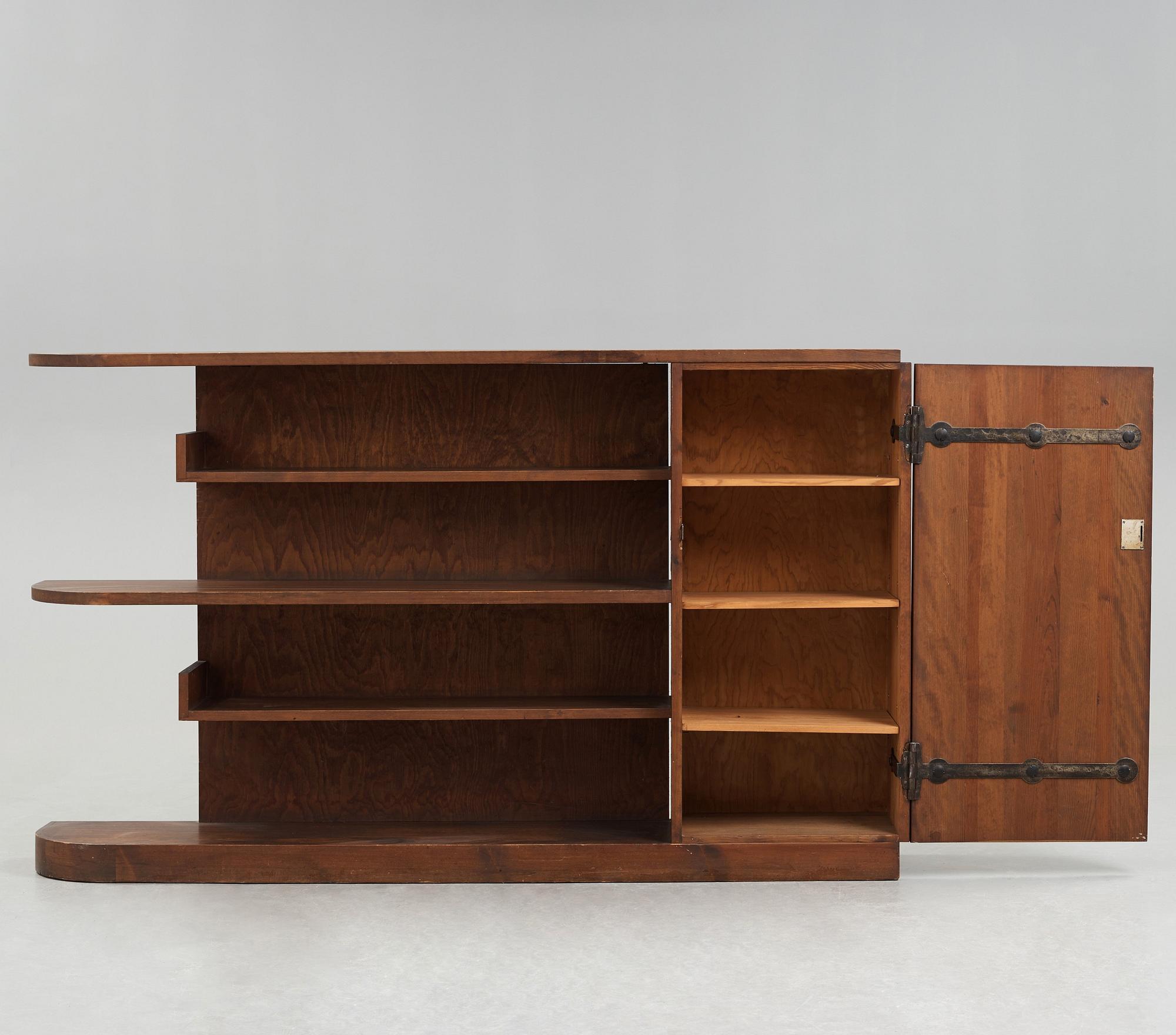 Axel Einar Hjorth, An Axel Einar Hjorth 'Lovö' stained pine bookshelf, Nordiska Kompaniet Sweden 1930's.