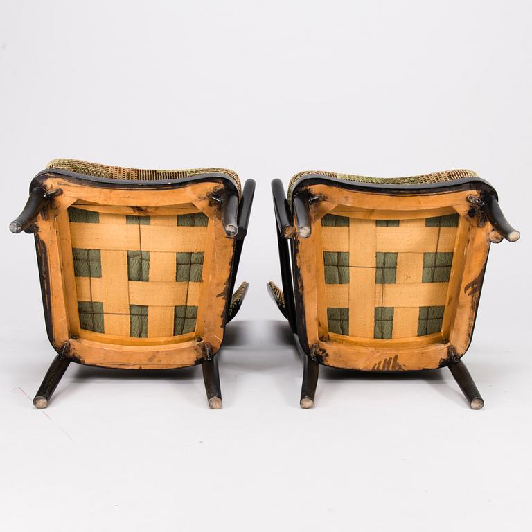 A mid-20th Century pair of armchairs.