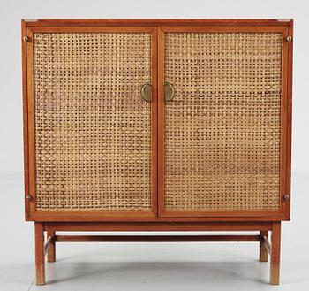 561. A Swedish mahogany and rattan cabinet, 1940-50's.