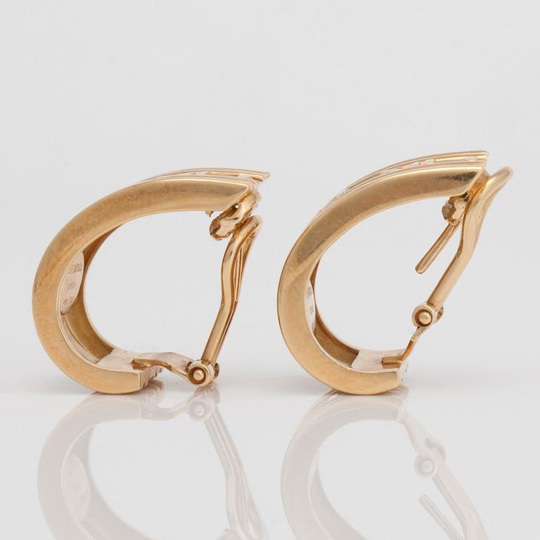A pair of Tiffany & co gold earrings.