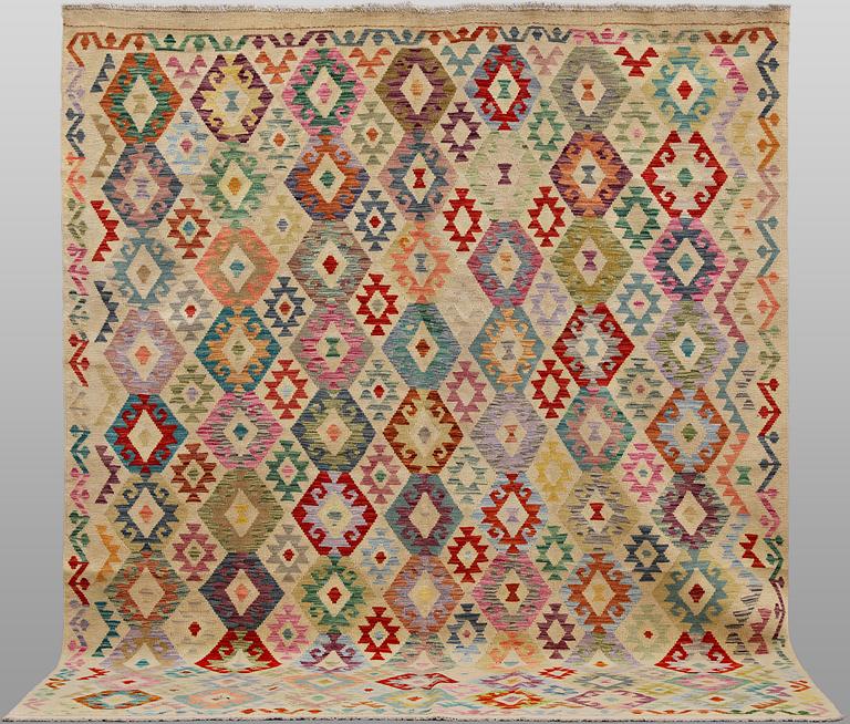 A Kilim rug, approx. 297 x 248 cm.
