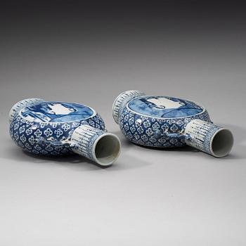 A pair of blue and white moon flasks, Qing dynasty, Qianlong (1736-95).